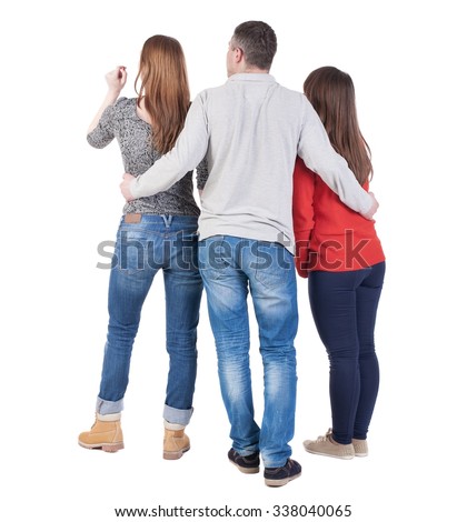 Back view of three friends  (woman and man). A guy in a gray jacket hugging two friends.  backside view of person.  Isolated over white background.
