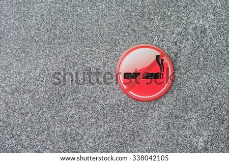 No smoking  sign on marble wall