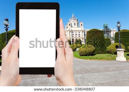 travel concept - tourist photographs Museum Natural History (Naturhistorisches) at Maria Theresien Platz in Vienna on tablet pc with cut out screen with blank place for advertising logo
