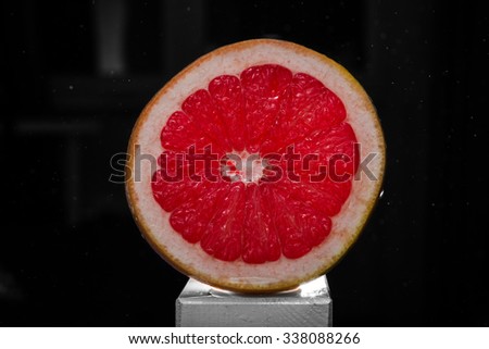 grapefruit on a black background