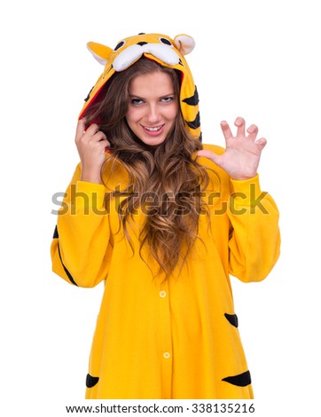 portrait of pretty young woman in the tiger costume isolated on white with copyspace studio shot