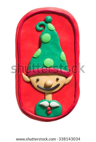 Elf cartoon character handmade of plasticine. Christmas and New Year holiday picture.