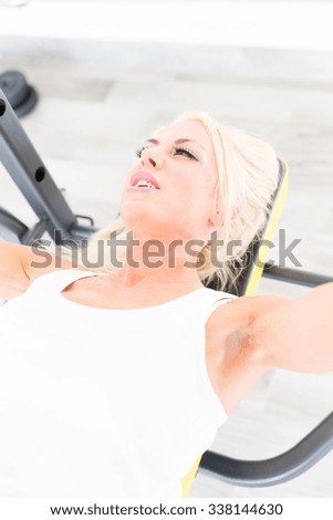 Fitness with young, blond woman