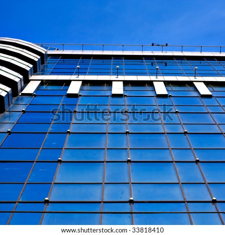 Blue windows of skyscrapers business center on blue sky background