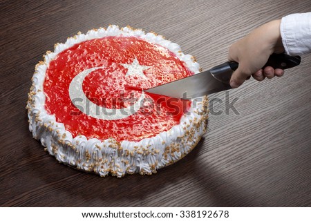 The symbol of war and separatism: a cake with a picture of the flag of Turkey is broken into pieces