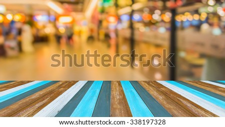 Blur image of shopping mall with shining bokeh lights for background.