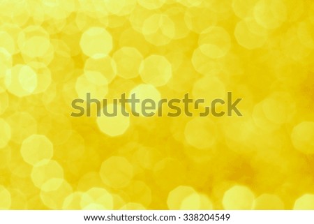 Gold and yellow Christmas Glittering background. Holiday abstract texture Festive background with defocused Golden bokeh