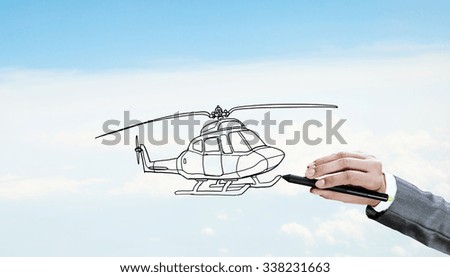 Hand drawing with stylus helicopter model on sky background