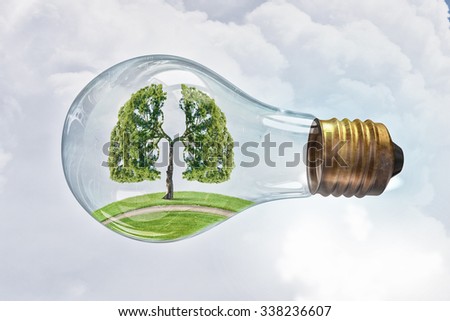 Glass lightbulb with green tree growing inside