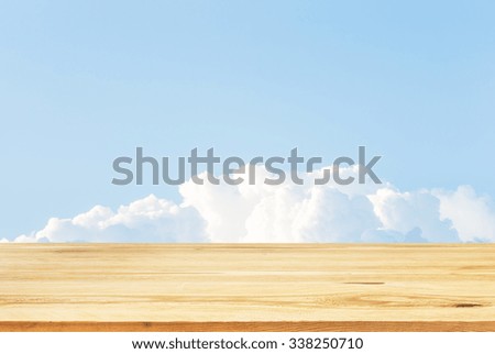 Wood table top on summer blue sky background - can be used for display or montage your products