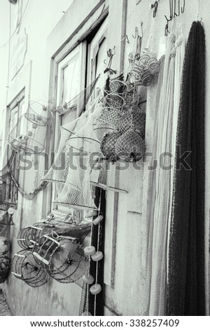Fishing gear for sale. Portugal. Aged photo. Black and white.