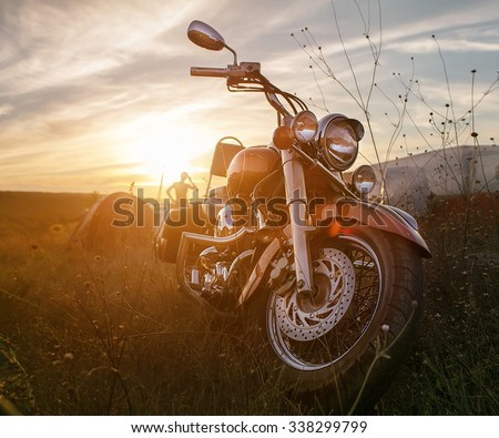 Freedom.Motorbike under sky.Vintage photo effect added for create atmosphere Royalty-Free Stock Photo #338299799