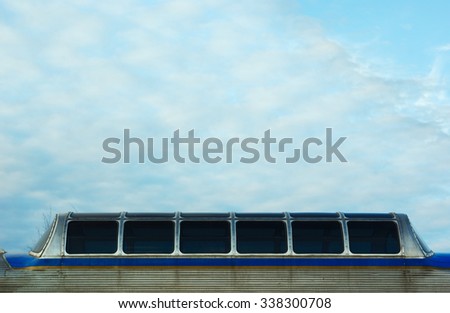 passenger window train wagon on cloudy sky early morning