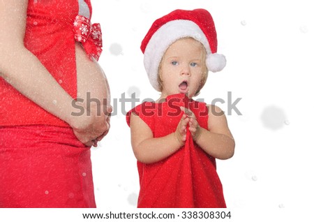 Surprised pregnant woman and child on Christmas and snowflakes