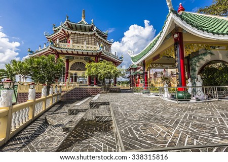 Pagoda and dragon sculpture of the Taoist Temple in Cebu, Philippines. Royalty-Free Stock Photo #338315816