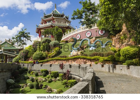 Pagoda and dragon sculpture of the Taoist Temple in Cebu, Philippines. Royalty-Free Stock Photo #338318765