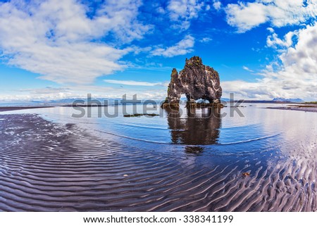 Stone "mammoth" Iceland. The picturesque cliff in Bay of Hoonah. Hvitserkur rocks during low tide at sunset Royalty-Free Stock Photo #338341199