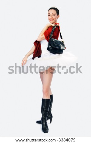 White girl in tutu on a grey background