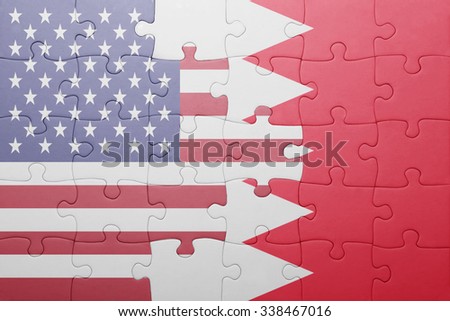 puzzle with the national flag of united states of america and bahrain.concept