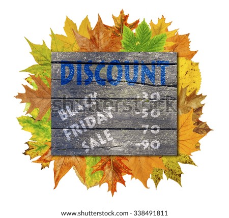 Wooden cube with autumn leaf around and word Black Friday Sale Discount isolated on white