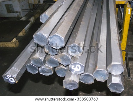 steel hexagon bars in factory warehouse Royalty-Free Stock Photo #338503769