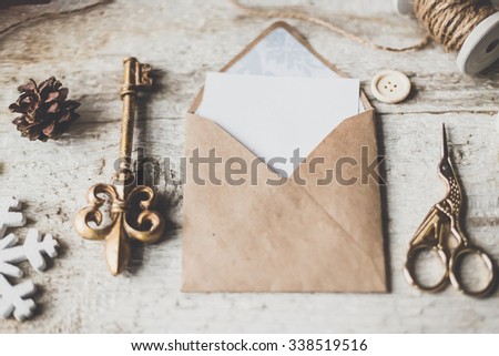 Stylish branding mockup to display your artworks. Cute vintage christmas new year gifts mock up on wooden background.