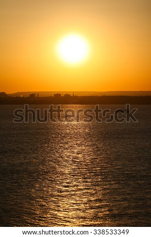 New Jersey waterfront at sunset viewed from the Upper New York Bay in New Jersey, USA.