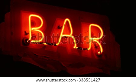 neon sign of a bar