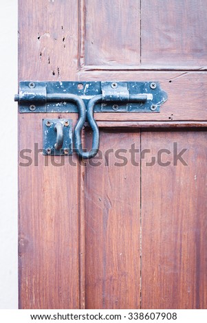 Closeup vintage wooden door locked , stock photo