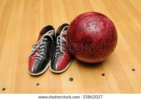 Bowling shoes and ball on the lane