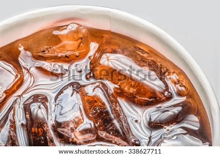 Cola, Cola in glass with ice on white background, Close up, top view