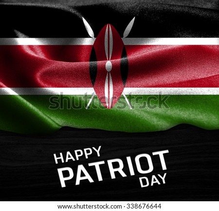 Happy Patriot Day Kenya flag on wood Texture background