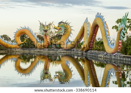 Colorful of twins dragon statue with beautifully blue sky at public park 