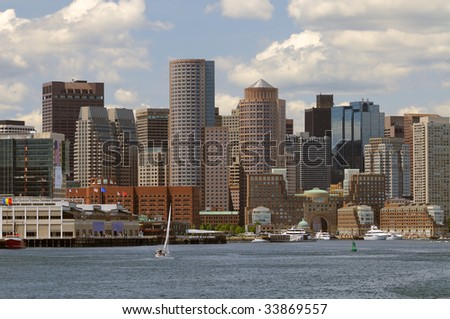 Boston harbor and cityscape. Skyline of downtown district office and apartment buildings facing the waterfront.