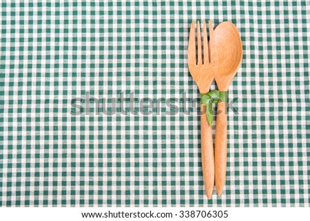 spoon and fork wood in  table cloth