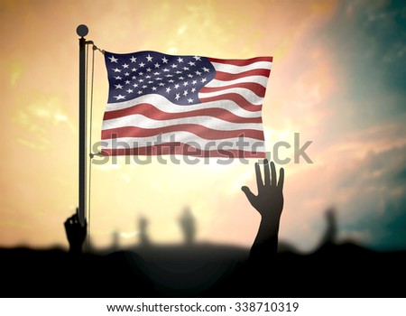 Patriot day concept: Silhouette people raise hands and USA flag over sunset background