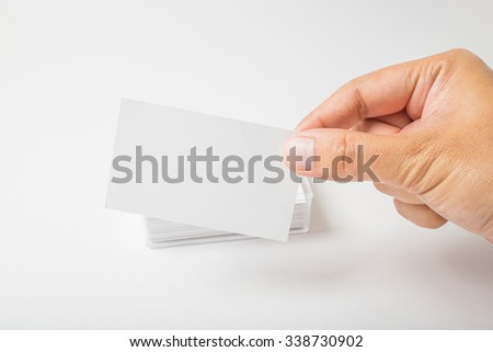 Hand hold blank business card on white background