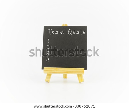 Art board, wooden easel, front view with word team goals over white background