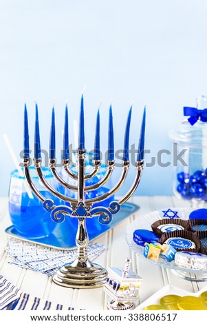 Table set with cocktails and chocolates to celebrate Hanukkah.