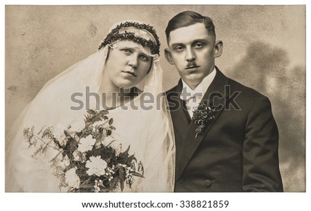 Vintage wedding photo. Just married couple. Nostalgic picture with original film grain and scratches Royalty-Free Stock Photo #338821859