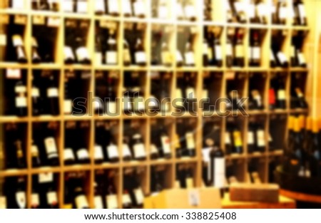 The blurry photo of wine shop scene background represent the wine and liquor business concept related idea.