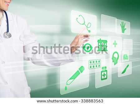 Young woman doctor touching icon of media screen