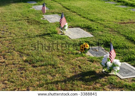Graves are decorated in remembrance of loved ones on Memorial Day