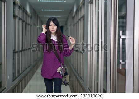 Asian girl in casual wear at university