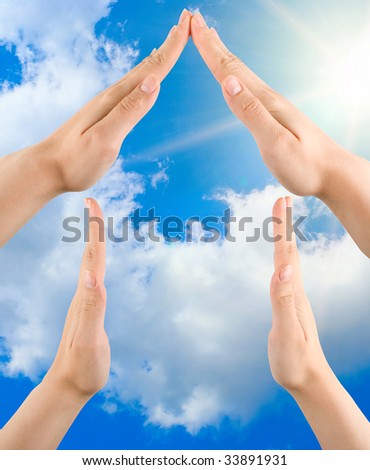hand home gesture on the blue sky background