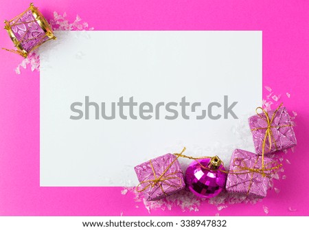 Blank card with Christmas ornaments decoration on pink background