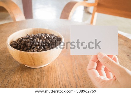 Roasted coffee bean and business card, stock photo