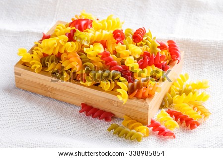 Close up gluten free corn and vegetable pasta spirals macaroni, food for wheat allergy person