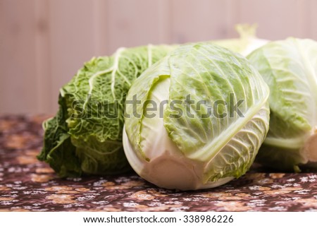 Heads of ripe delicious white and chinese cabbage vegetable with green leaves and lot of minerals organic food studio on blur background, horizontal picture