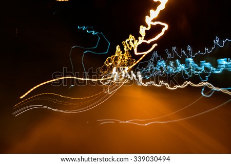 Photograph of some blurred lights on a night urban scene